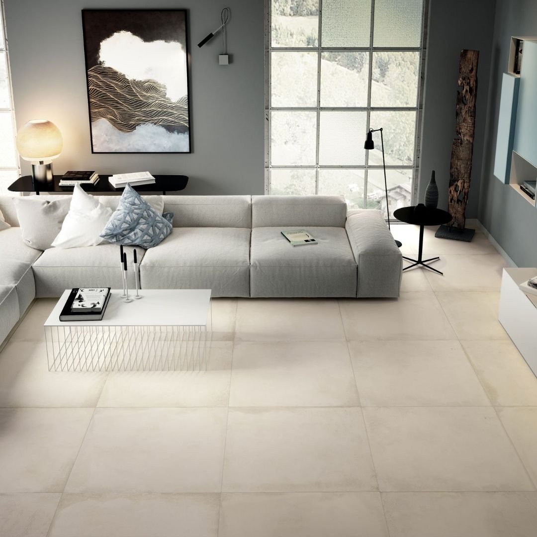 Borigni by Emser oversized tile in a modern living space with large white sectional sofa